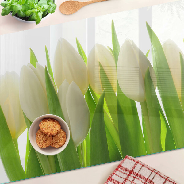 Skleněná deska do kuchyně Tulipány na pozadí zelených listů