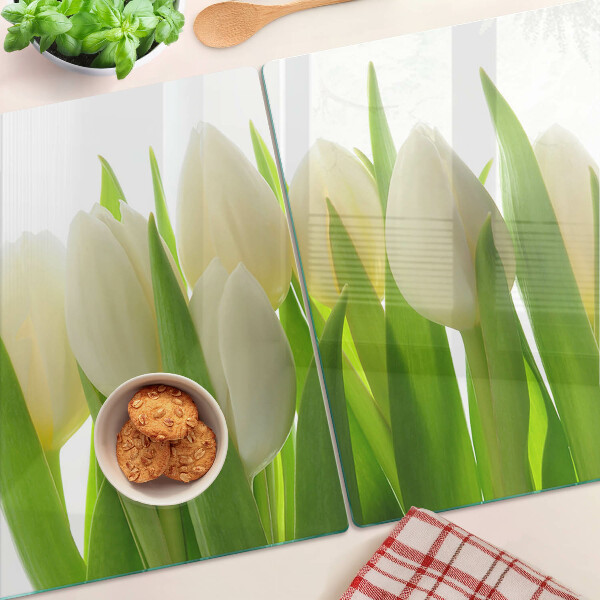Skleněná deska do kuchyně Tulipány na pozadí zelených listů