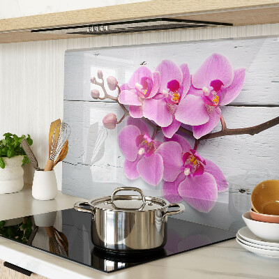 Skleněná deska do kuchyně Orchideje na bílém pozadí