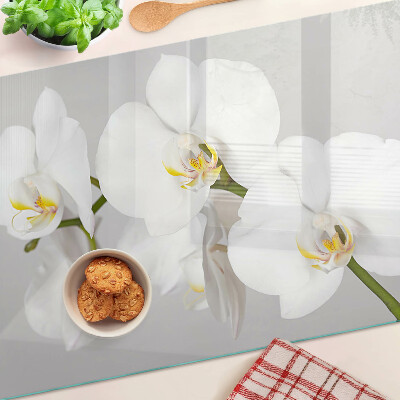 Skleněná deska do kuchyně Orchideje na zrcadlovém pozadí