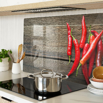 Skleněná deska do kuchyně Chilli papričky na dřevěném pozadí