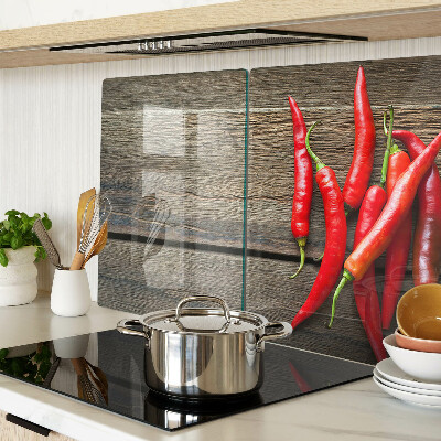 Skleněná deska do kuchyně Chilli papričky na dřevěném pozadí