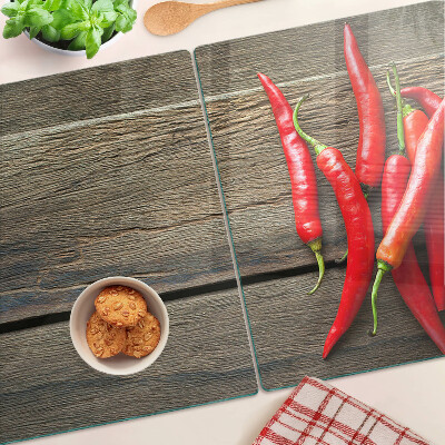 Skleněná deska do kuchyně Chilli papričky na dřevěném pozadí