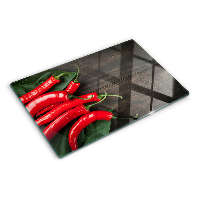 Skleněné krájecí prkénko Chilli papričky na dřevěném pozadí