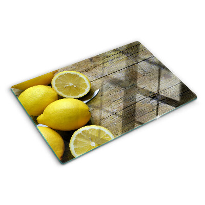 Skleněné krájecí prkénko Citrony na dřevěném pozadí