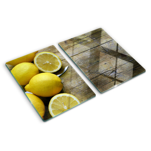 Skleněné krájecí prkénko Citrony na dřevěném pozadí