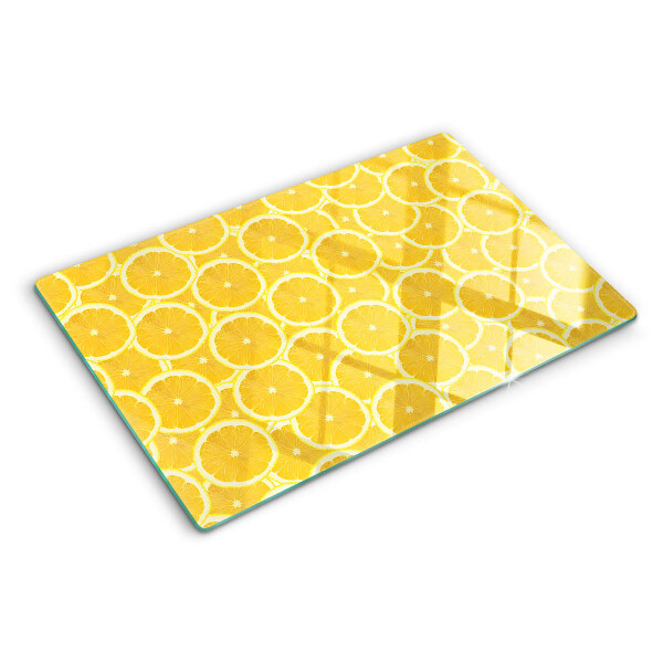 Skleněná krájecí deska Plátky citronu na žlutém pozadí
