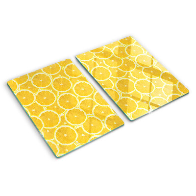 Skleněná krájecí deska Plátky citronu na žlutém pozadí