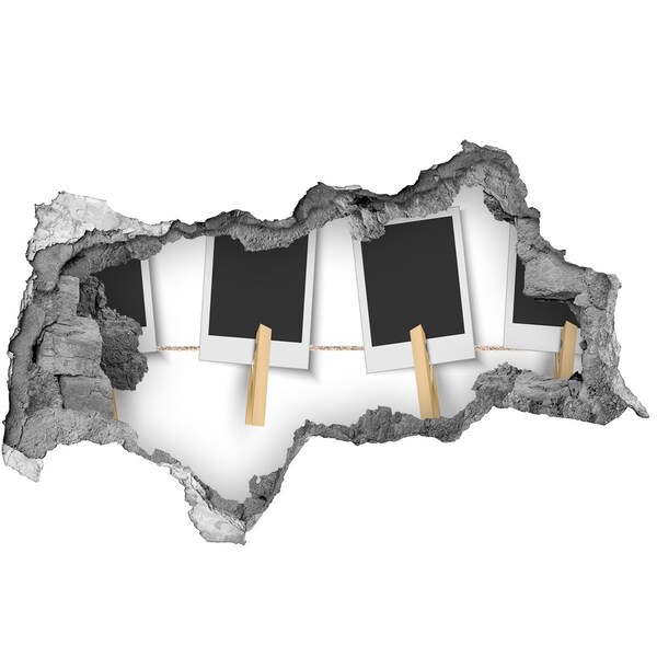 Foto fotografie díra na zeď Poškozená zeď s obrazovými rámy