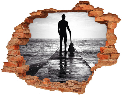 Fototapeta díra na zeď Hudebník na molu