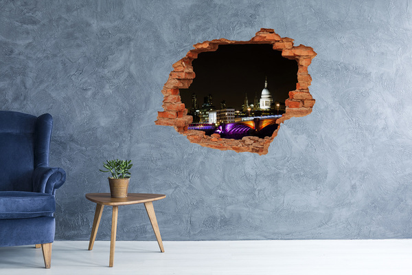 Fototapeta díra na zeď 3D Noční pohled na Londýn skrz díru ve zdi