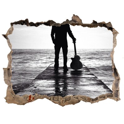 Fototapeta díra na zeď Hudebník na molu