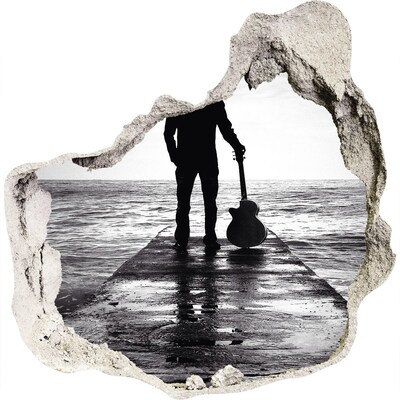 Fototapeta díra na zeď Hudebník na molu