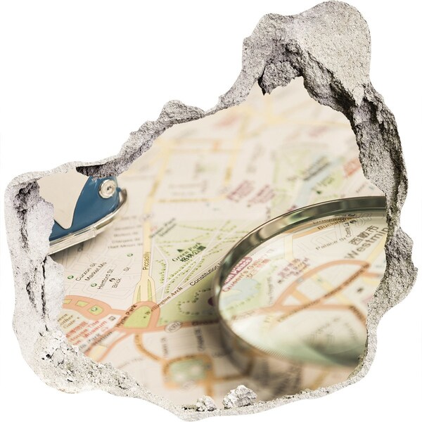 Samolepící díra na stěnu Mapa s lupou v díře ve zdi