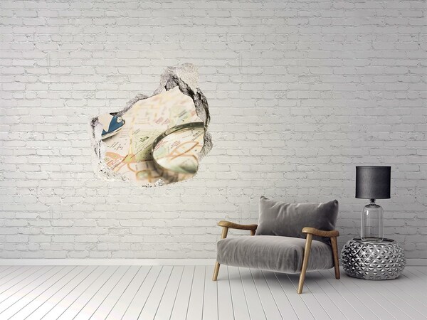 Samolepící díra na stěnu Mapa s lupou v díře ve zdi