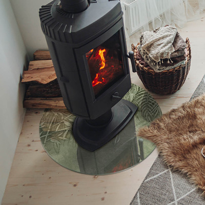 Kulatá skleněná podložka pod kamna Tropické listy na pozadí