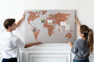 Nástěnka Mapa světa proti cihlové zdi